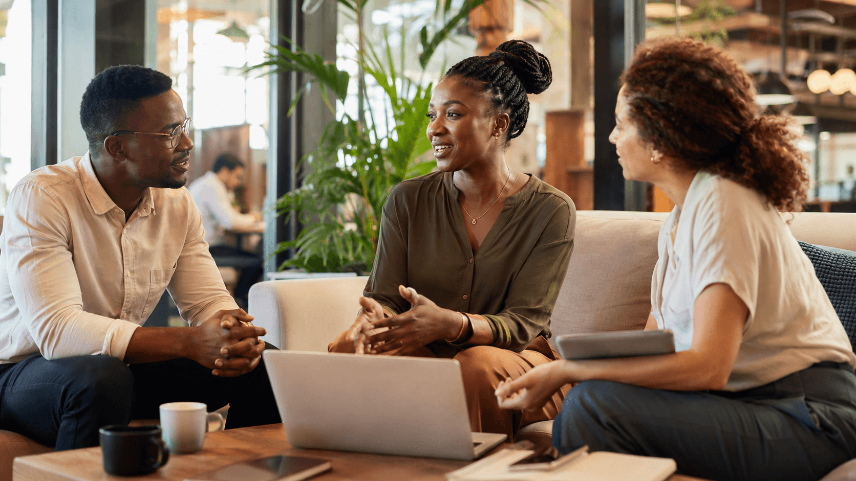 Team discussing workplace training in a meeting room